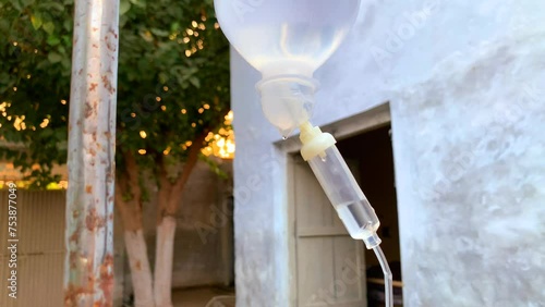 Close up saline solution drip for patient and infusion in hospital. Close view of an IV Drip. 4K