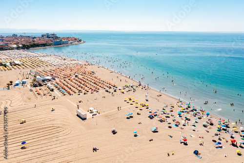 Aerial view of people at the beach enjoying summer