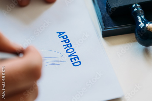 Man Signing Approved Document photo