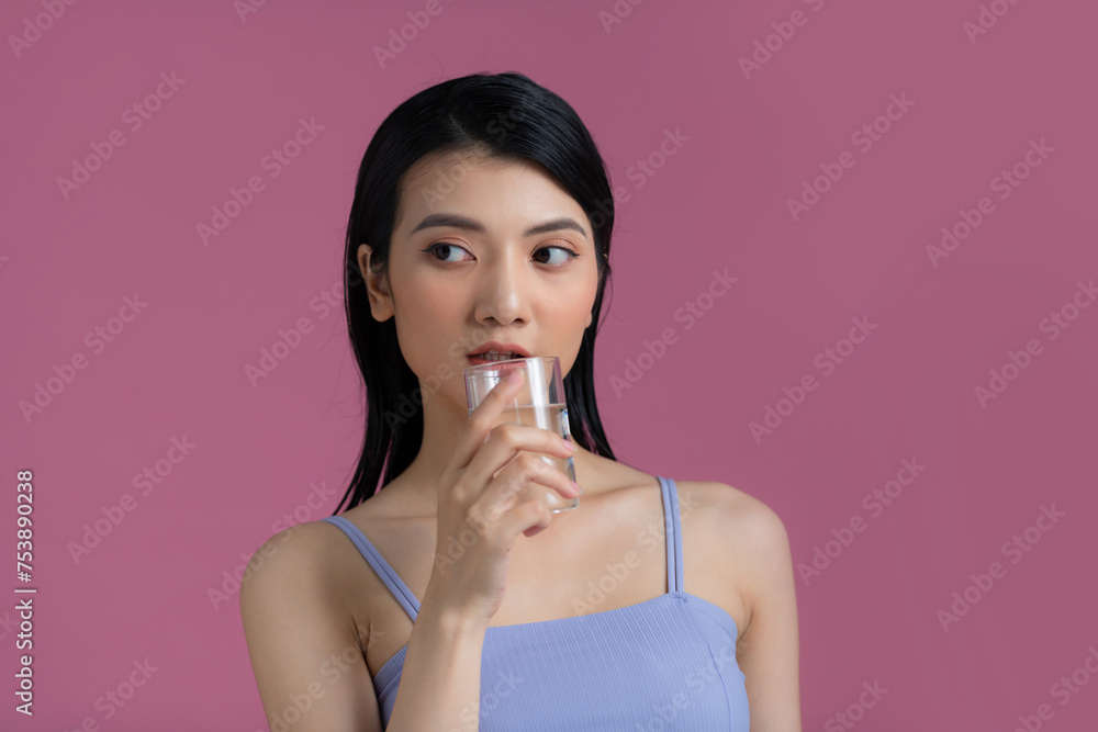 young beautiful woman drinks water from a glass young beautiful woman drinks water from a glass