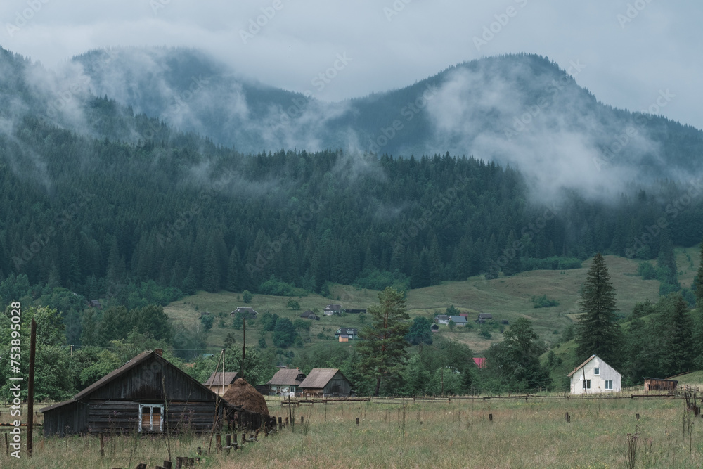 Cloudy mountain village after the rain. Fog on the mountain after the rain Cloudy mountain village after the rain. Fog on the mountain after the rain