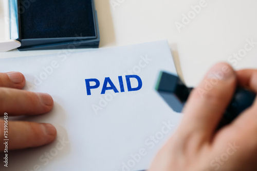 Man Signing Paid Document