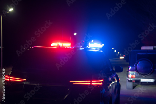 Red and blue lights of a police car at night, stock photo photo