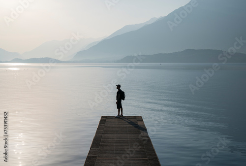 Man standing at lake photo
