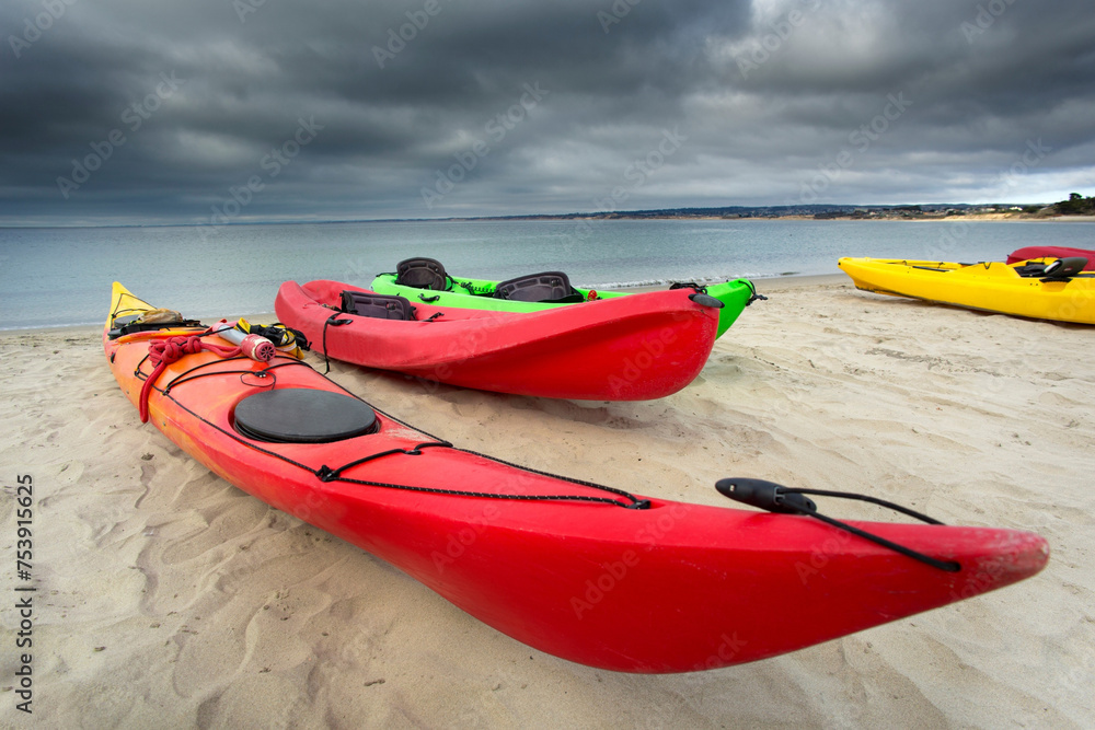 Adventure Amidst the Storm: 4K Ultra HD Image of Colorful Red Kayak by the Sandy Ocean Beach on a Stormy Day Adventure Amidst the Storm: 4K Ultra HD Image of Colorful Red Kayak by the Sandy Ocean Beach on a Stormy Day