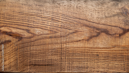 Brown wood grain on a beautiful old plank.