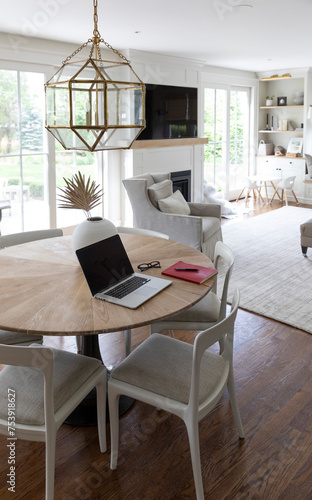 Contemporary House Book shelf cabinetry and Laptop computer on table photo