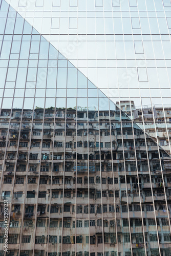 Distorted view of buildings reflected in windows of a modern skyscrape photo