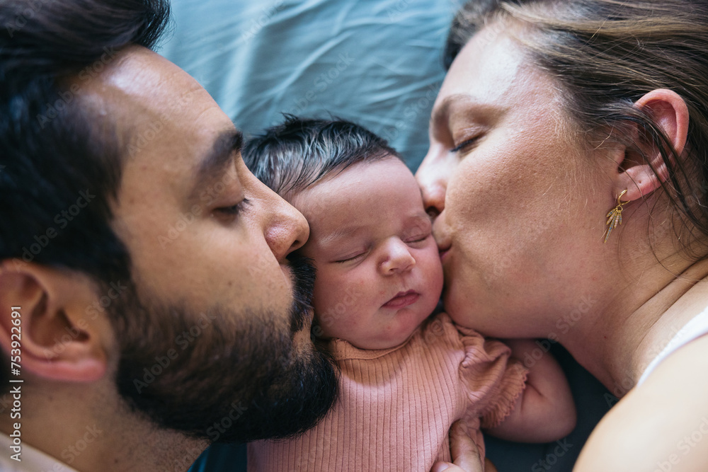 Parents taking a nap with newborn baby Parents taking a nap with newborn baby