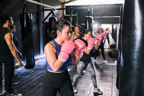 Women boxing in a gym photo
