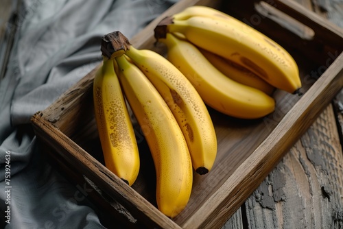 Wooden Box Filled With Ripe Bananas on a Table