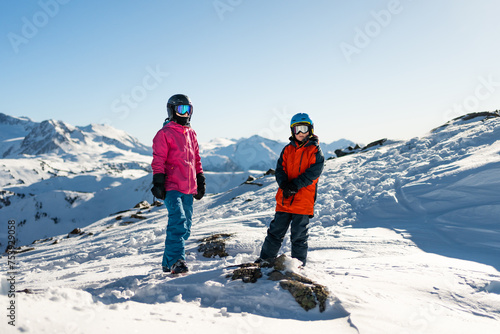 mother and son in snowcovered mountains photo