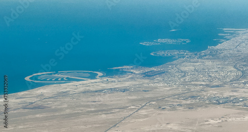 aerial landscape view of Dubai coastline, United Arab Emirates, with The Palm, The World and other attractions all around the Megacity