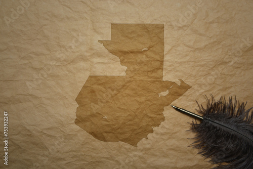 map of guatemala on a old paper background with old pen photo