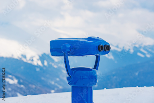 Binoculars on the mountain viewpoint at winter day.