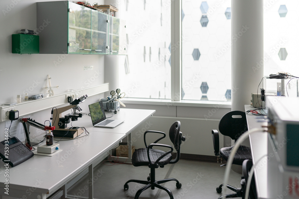 Table With Laptop And Microscope In Lab Table With Laptop And Microscope In Lab
