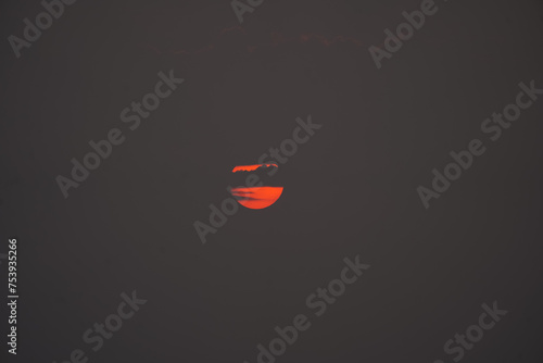 Magic orange sunset view.
A sunset is a natural phenomenon that occurs daily as the sun dips below the horizon, marking the end of daylight hours. It is a breathtaking and often picturesque event 