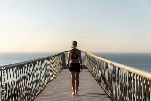 Mindful woman relaxing after running workout photo