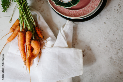 Freshly dug homegrown and irregular carrots photo