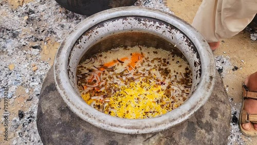 Degi mutanjan , sweet and colorful , Meethe chawal. Zardah Rice, Mutanjan rice, also known as sweet rice, favourite Indian sweet,saffron, cashew, cloves,dry fruits, yellow rice 4K Footage. photo
