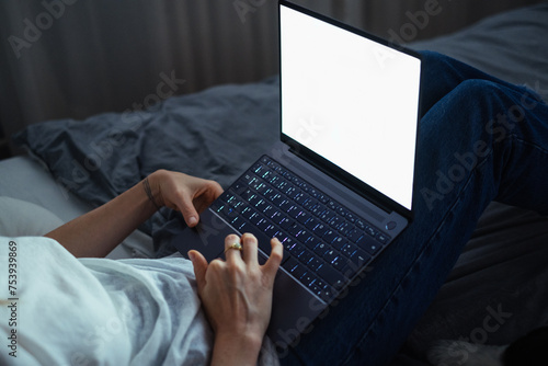Cropped Image of Woman Typing on Laptop at Night photo