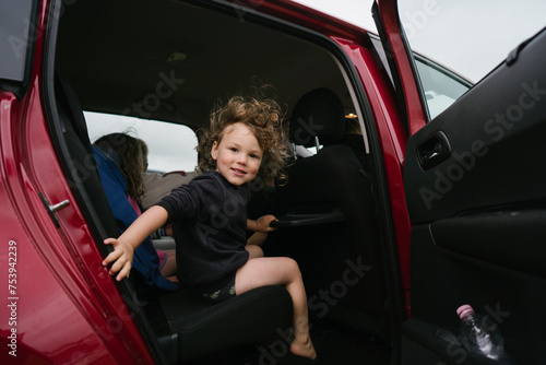 Family traveling in a car photo