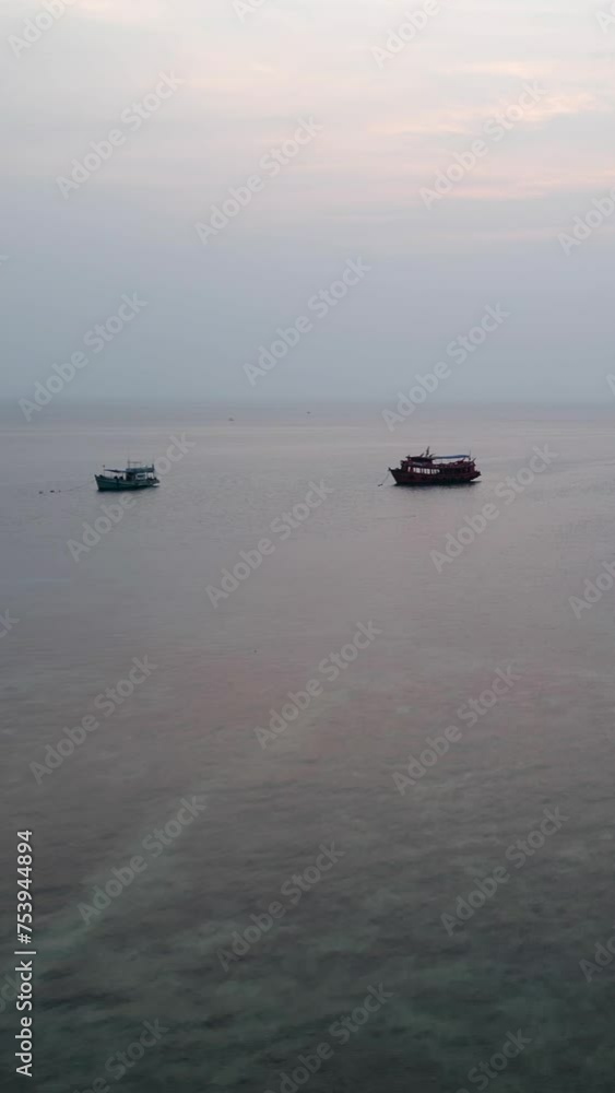 Several ships standing at sea at sunset Several ships standing at sea at sunset
