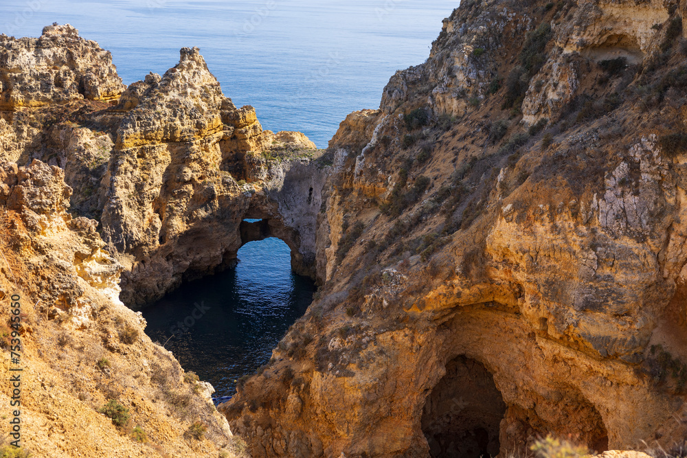 Rock arch in water, Ponta da Piedade rock formations. Travel destination in Europe. Ponta da Piedade in Lagos, Algarve, Portugal