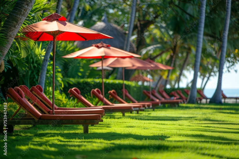 photograph of a Beautiful lawn with red umbrellas and sunbeds on the beach, a sunny day Generative AI photograph of a Beautiful lawn with red umbrellas and sunbeds on the beach, a sunny day Generative AI