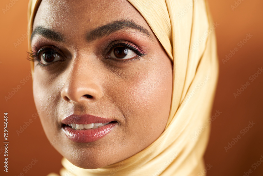 Muslim woman photographed against a seamless backdrop Muslim woman photographed against a seamless backdrop