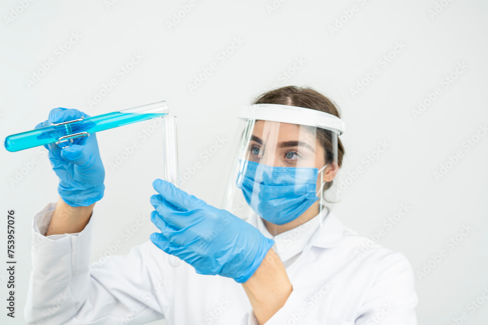 women scientist with test tube making research in clinical laboratory.Science, chemistry, technology, biology and people concept women scientist with test tube making research in clinical laboratory.Science, chemistry, technology, biology and people concept