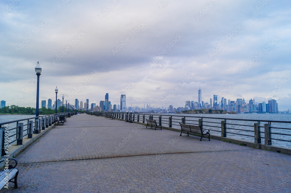 The Liberty State Park in Jersey City, NJ. Overlooking the New York and New Jersey Skylines in a cloudy afternoon.