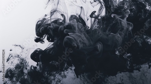 Black and grey smoke merging on an abstract background