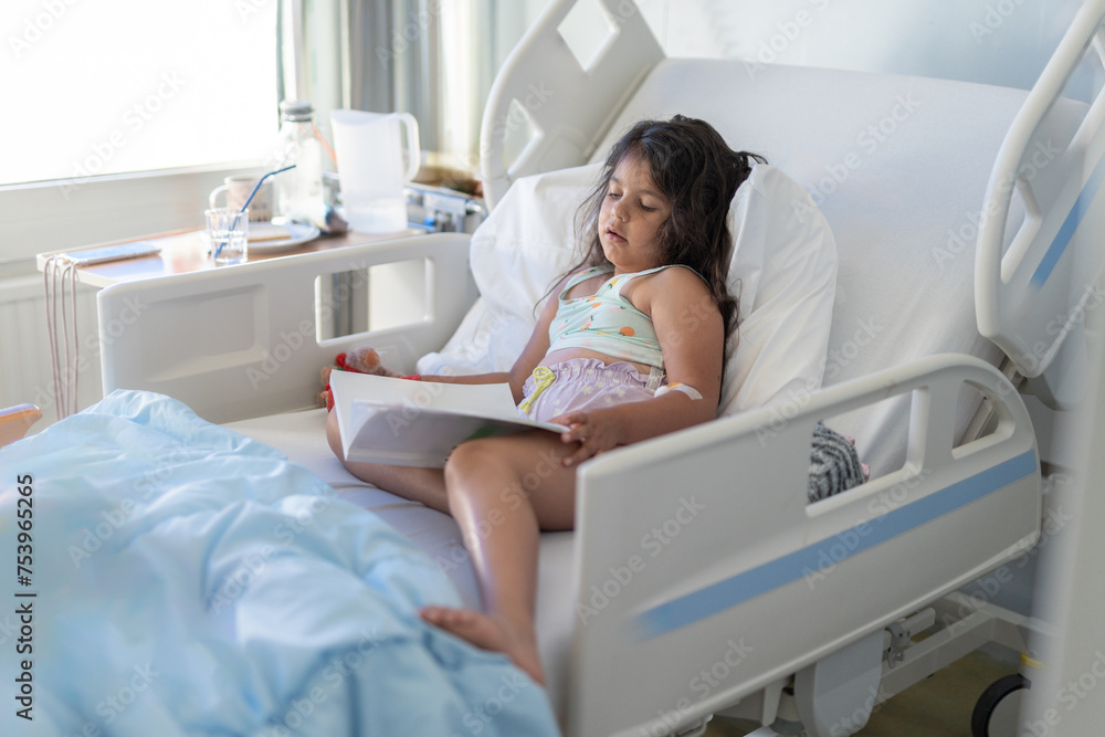 Child hospitalised in a hospital bed Child hospitalised in a hospital bed