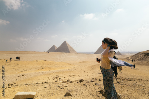 Female photographer at the pyramids of Egypt photo