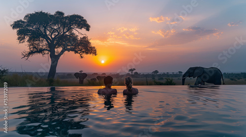 A couple in a swimming pool with the background Elephants in the savanna in Africa, a safari camp, and a luxury lodge pool in the bush in South Africa