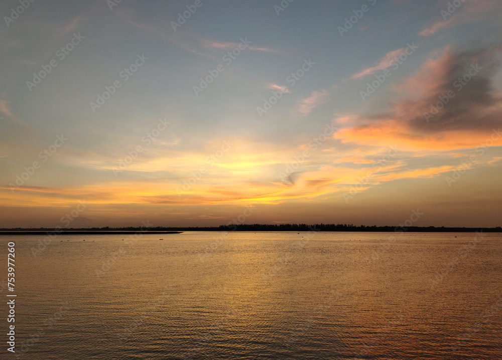 Evening time with reflection of sunlight on a large waterbody Evening time with reflection of sunlight on a large waterbody