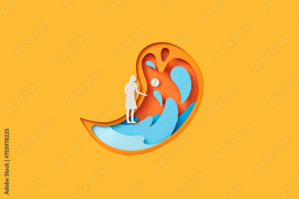 Paper female figure with pill standing inside human stomach Paper female figure with pill standing inside human stomach