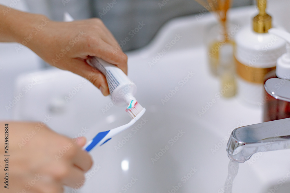 girl hands with toothbrush and toothpaste girl hands with toothbrush and toothpaste