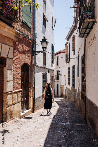 Young tourist strolling through the beautiful historic city photo