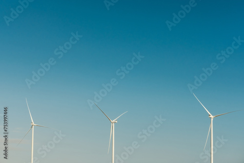 Wind turbines on a blue sky  photo