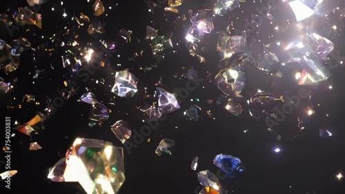 Sparkling gemstones of various colors emerge from the darkness, exploding with radiance.
