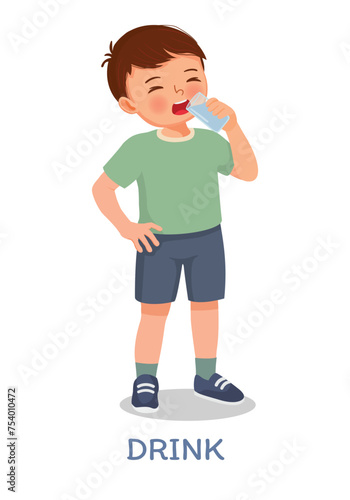 Cute little boy drinking a glass of water