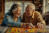 Happy senior couple playing ludo board game at home
