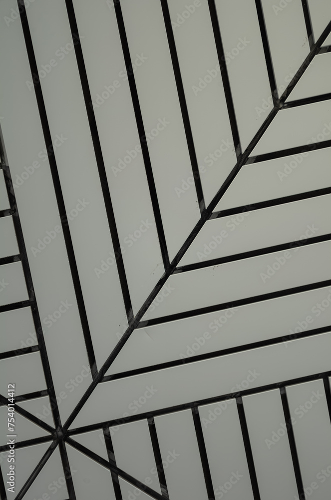 Fototapeta premium Abstract Background of Light Gray Ceiling Panels With Black Lines.