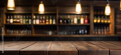 Rustic empty wooden table top of bar counter liquor store with copy space for your decoration. Vintage pub interior, Restaurant space. Abstract blurred bar background for product placement © MadeByAnas