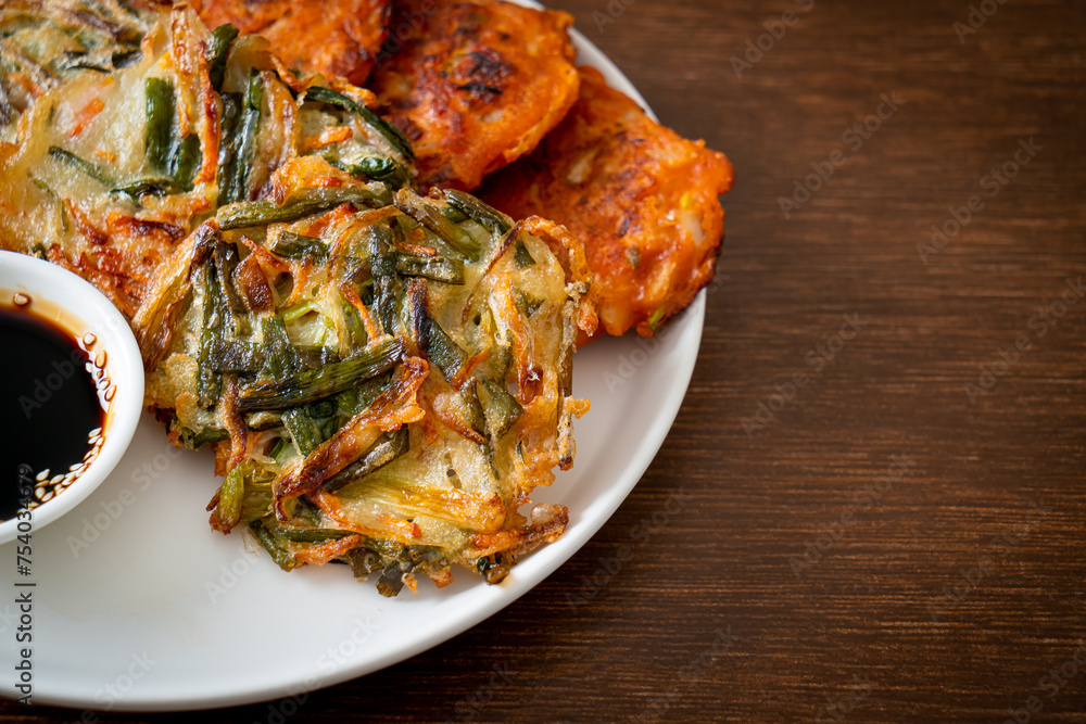 Pajeon or Korean pancake and Korean Kimchi pancake or Kimchijeon on white background Pajeon or Korean pancake and Korean Kimchi pancake or Kimchijeon on white background