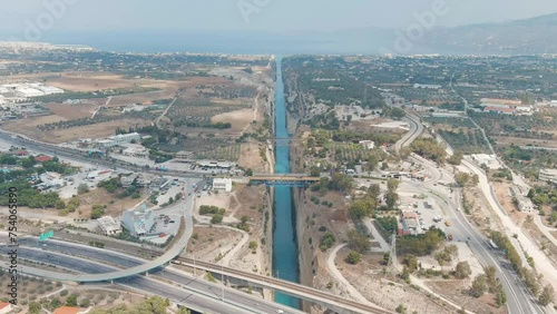 Dolly zoom. Corinth Canal, Greece. The Corinth Canal is a sluiceless shipping canal in Greece, connecting the Saronic Gulf of the Aegean and the Gulf of Corinth of the Ionian Sea, Aerial View, Depart photo