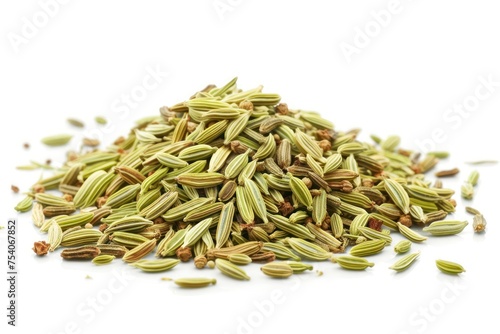 A pile of Fennel Seeds with a white background. The seeds are green and brown. The pile is small and scattered