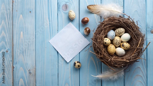 Design a minimalist Easter banner featuring feathered eggs in a nest on a blue wooden background. Capture the scene from a top view and include a card with space for a personalized message.